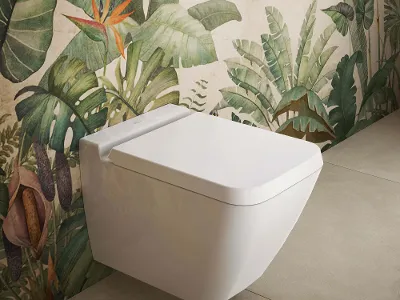 Des WC Finion blancs avec un abattant devant du papier peint végétal Des WC Finion suspendus avec abattant et couvercle sont fixés à un bâti-support avec un motif végétal.