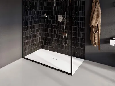 Un receveur de douche Squaro Infinity dans une salle de bains noire et blanche Une salle de bains noire et blanche avec une cabine de douche en verre et un receveur de douche Squaro Infinity.